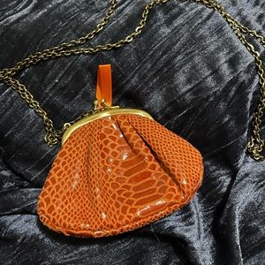 Wear It Declare It coin purse in orange with chain and snap up design